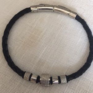 Men’s leather and stainless bracelet.